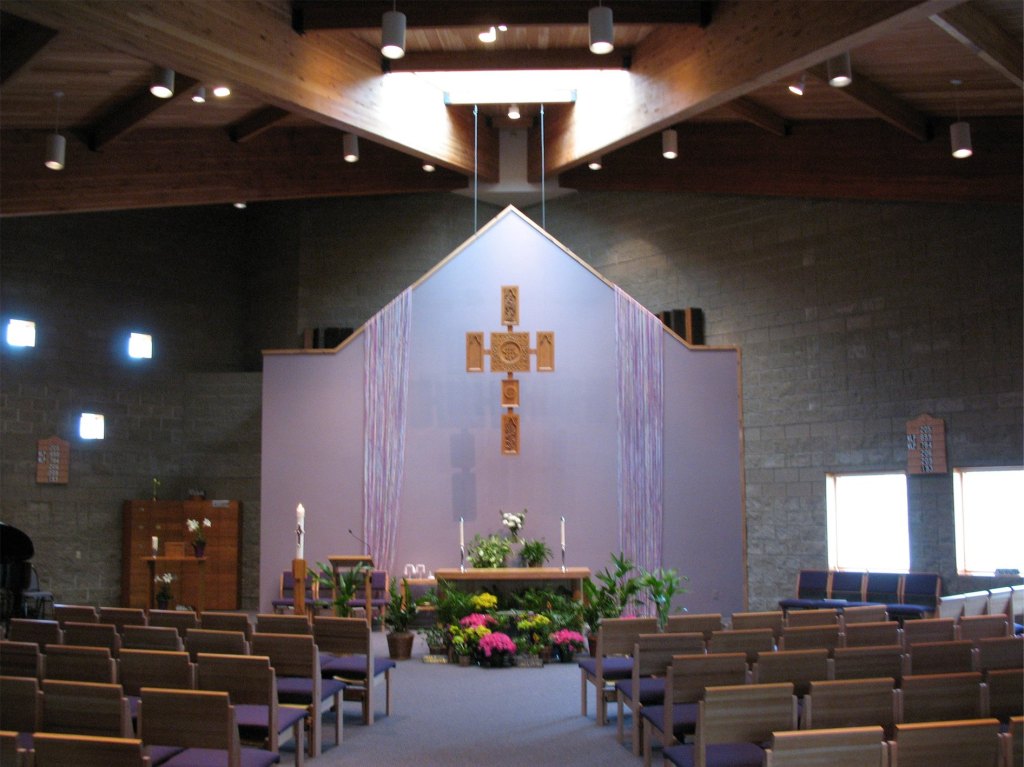 Church Sanctuary, Giant timber beams, and light purple walls. Dramatic lighting.