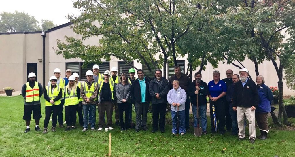 Crew breaking ground for a tiny house building project. 